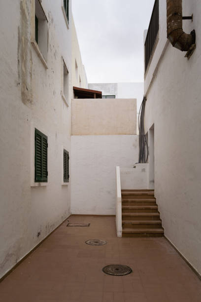 istock Charming Spanish Architecture: White Building with Green Shutters and Staircase in Corralejo, Fuerteventura, Spain 1761557798