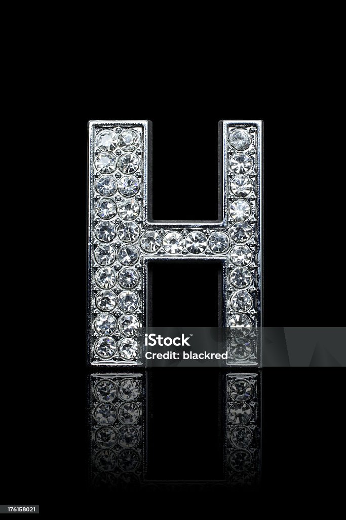 Diamond Alphabet H "Glamour diamond letter H with platinum outline. Isolated on black background. Not 3D rendering, it's a shot from a real object, each diamond has different reflections." Alphabet Stock Photo