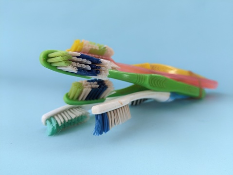A pile of unused toothbrushes