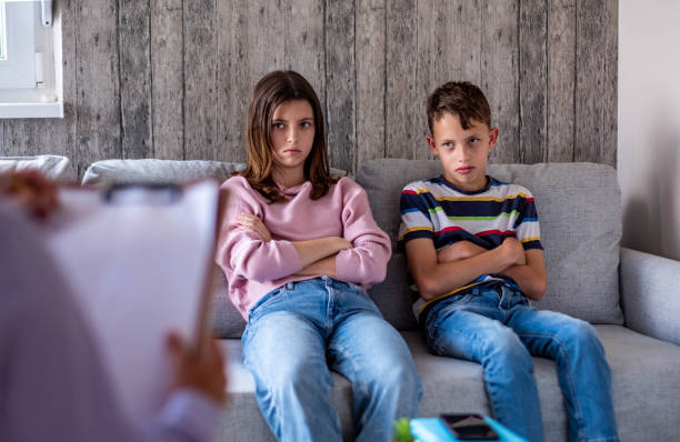 istock brother and sister at an interview with a psychologist 1761596092