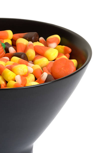 istock Halloween candy in black bowl on white background 176160043