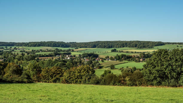 istock Village in lush hilly countryside under a blue sky during summer. 1761611159