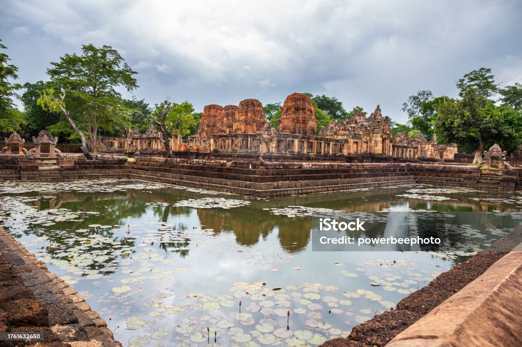 Fantastic ancient ruins of Prasat Muang Tam with a sacred well surrounding it near Phanom Rung Prasat Historical Park. Buriram Province, Thailand Ancient Stock Photo