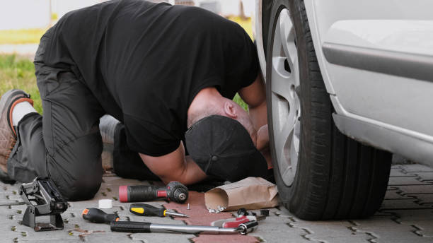 istock Mechanic Repairs Car Working On Suspension 1761633991
