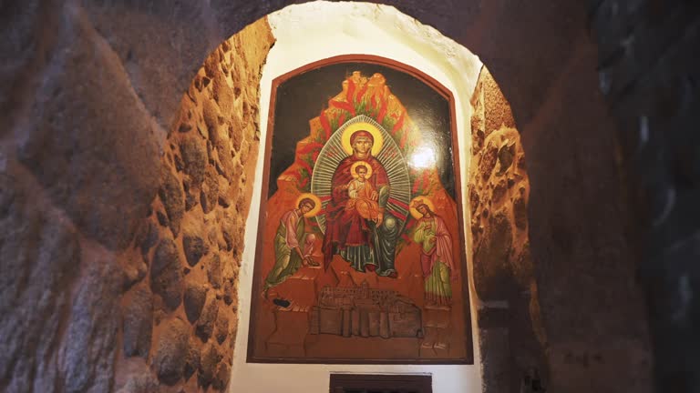 The entrance door to the Saint Catherine Monastery with the icon on the wall. Ancient historical religious place at Mount Sinai. Tourist excursion to the Mountain of Moses