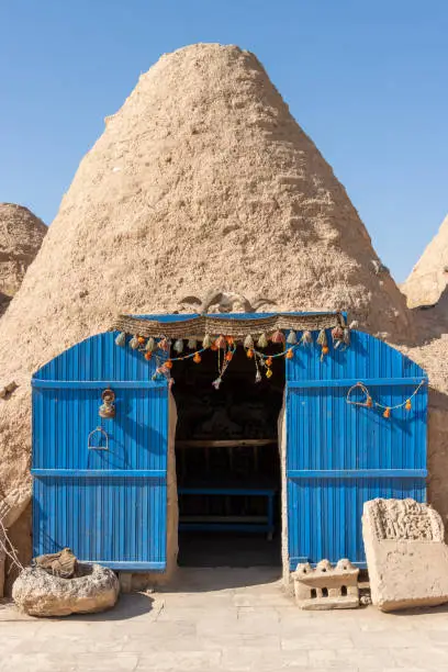 A beehive or tomb house is a building made from a circle of stones and mud topped with a domed roof. The name comes from the similarity in shape to a straw beehive.
