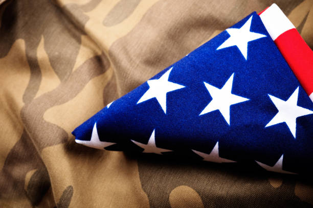 istock Camouflage and folded American Flag (xxxl) 176164078