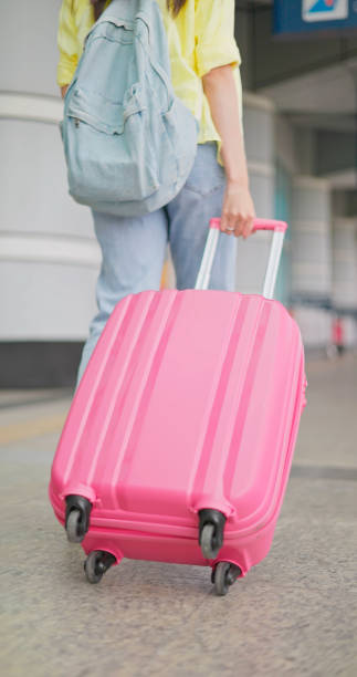 istock close up dragging suitcases airport 1761642904