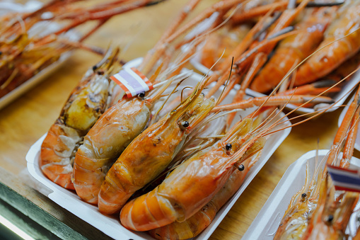 Prawns on bowl. Shrimps, prawns. Whole boiled shrimp. Seafood. Top view, banner, copy space