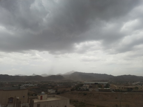 Al-Bahah region, dense clouds gather in a dramatic gray sky warning of rain on an autumn day with volatile weather