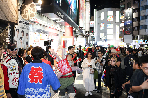Crowds of people head to Shibuya street for a Shibuya Halloween event on October 28, 2023 in Tokyo, Japan. It was the first time after four years that the festival was held due to the COVID-19 pandemic.