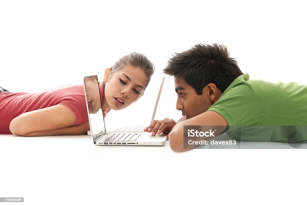 Interesting work Young ouple looking interested to their laptopFriends Adult Stock Photo
