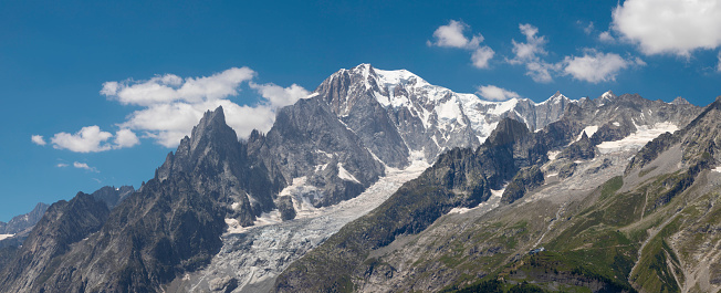 Mont Blanc and Grandes Jorasses above the winter clouds in the valley.