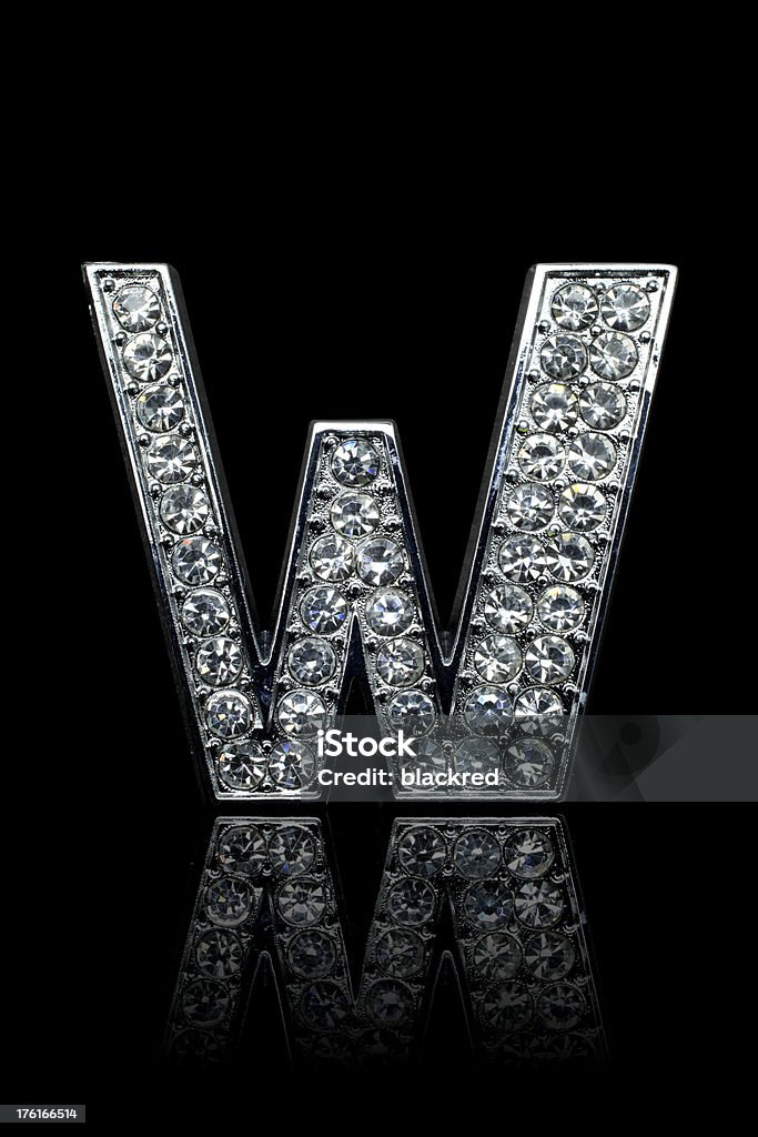 Diamond Alphabet W "Glamour diamond letter W with platinum outline. Isolated on black background. Not 3D rendering, it's a shot from a real object, each diamond has different reflections." Alphabet Stock Photo