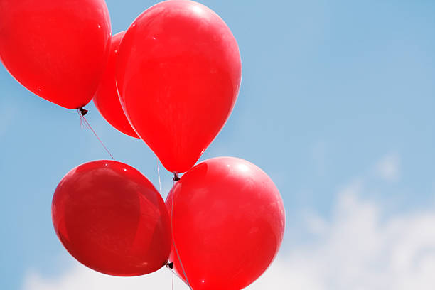 istock Red Balloons Against Blue Sky 176166999