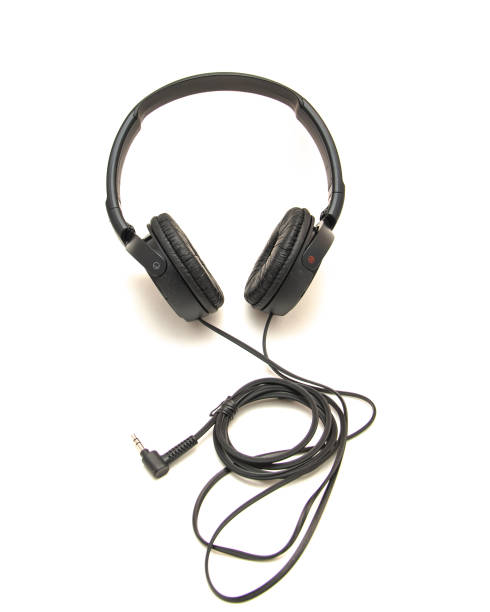 istock Side view black wired headphone with swiveling earcup foam cushions, L-shaped stereo mini plug 3.5mm isolated on white background, corded kids headphones dome type 1761675564