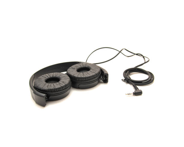 istock Swiveling earcup on wired headphone allows easy storage, enhances portability when traveling with L-shaped stereo mini plug 3.5mm isolated on white background, corded kids headphones 1761675577