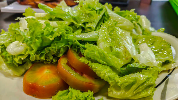 istock Close-up view of salad vegetables on a white plate 1761677187