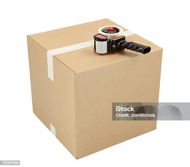 Cardboard Box And Tape Gun Stock Photo - Download Image Now - Adhesive Tape, Freight Transportation, Shipping