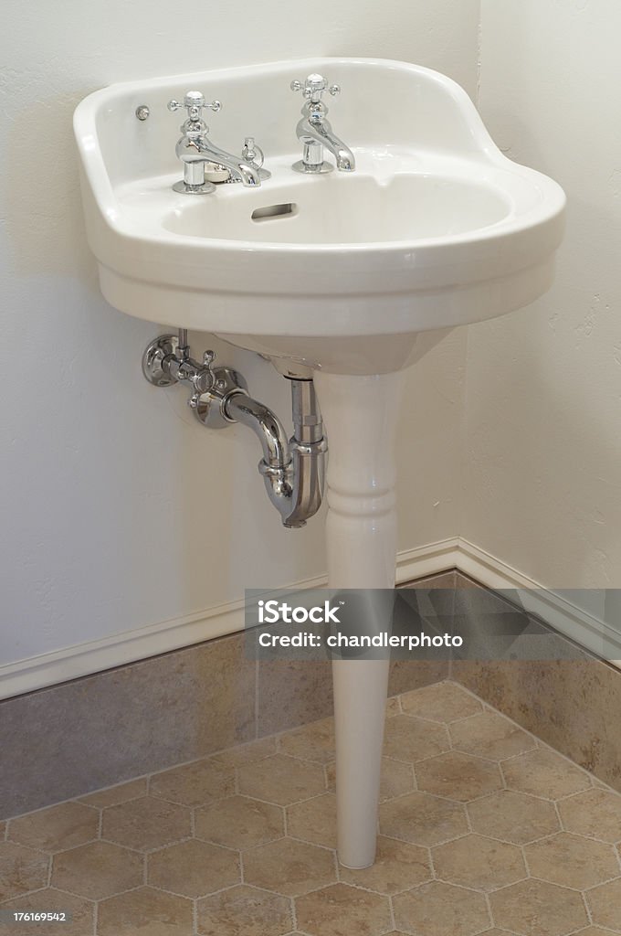 Sink This close up bathroom sink sits on a pointed pedestal. Pedestal Stock Photo