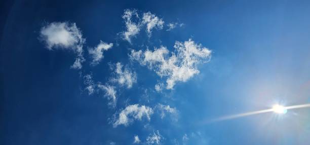 istock Beautiful white cumulus clouds in the blue sky 1761697319