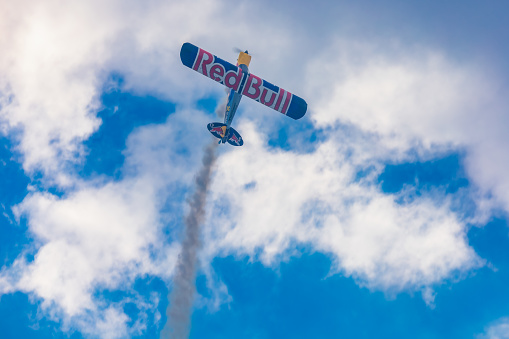 Leszno, Poland - June 17 2023: Antidotum Airshow Leszno 2023 and acrobatic shows of Lukasz Czepiela in Carbon Cub UL plane flying on a cloudy sky