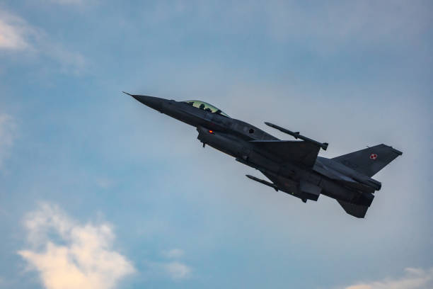 Antidotum Airshow Leszno 2023 and acrobatic shows full of smoke of F-16 Tiger Demo Team on a cloudy sky Leszno, Poland - June 17 2023: Antidotum Airshow Leszno 2023 and acrobatic shows full of smoke of F-16 Tiger Demo Team on a cloudy sky f 16 demo team stock pictures, royalty-free photos & images