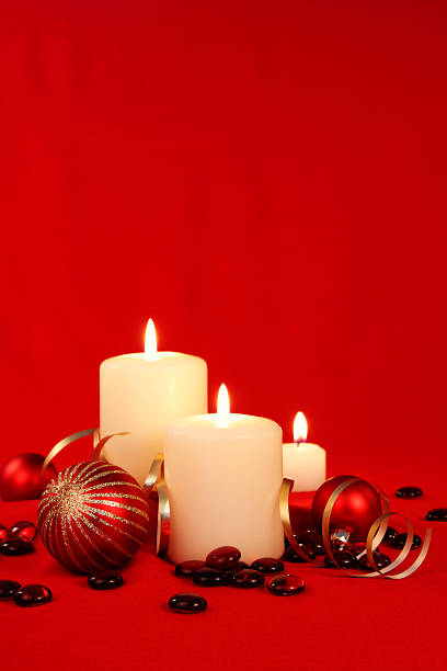 istock Three white christmas candles and ribbon on a  isolated background 176172127