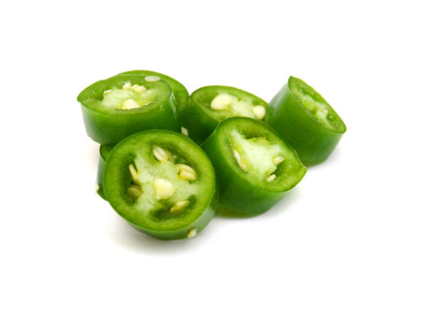 istock Fresh green cut chili pepper pieces on a white background 1761747975