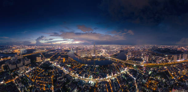 istock Aerial sunset view at Landmark 81 - it is a super tall skyscraper and Saigon bridge with development buildings along Saigon river 1761751340