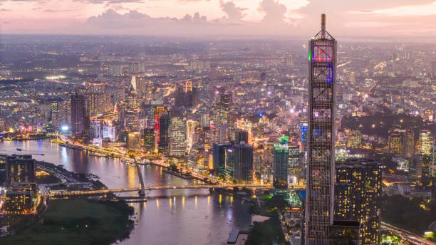 istock Aerial sunset view at Landmark 81 - it is a super tall skyscraper and Saigon bridge with development buildings along Saigon river 1761751380