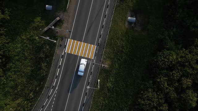 Aerial Tracking Shot of White Car Driving Fast on Highway. Chasing the Hijacker