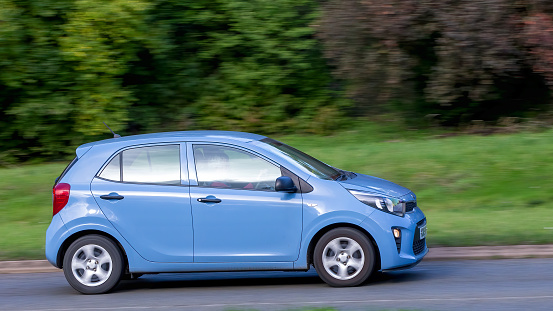 Milton Keynes,UK - Oct 28th 2023:  2019 blue Kia Picanto  car driving on an English road