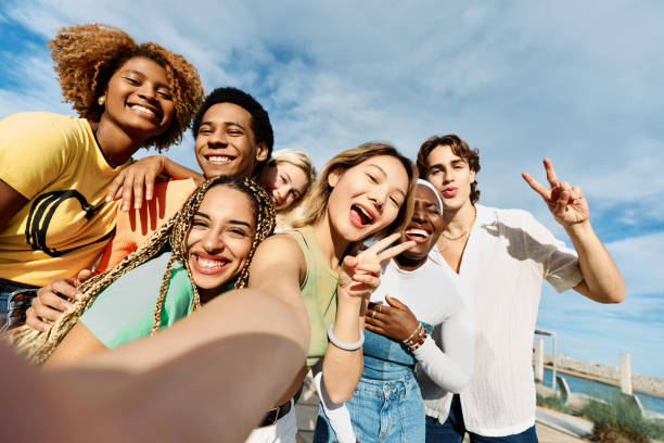 istock Chinese woman taking a selfie with multi-ethnic friends 1761862611