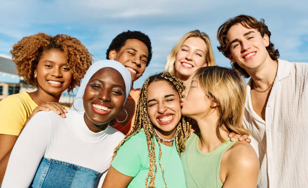 istock Young people of multiples cultures embracing and smiling 1761863131