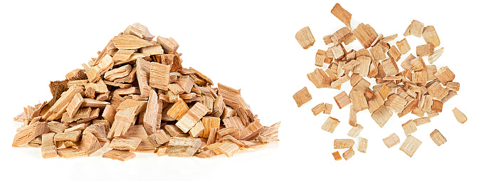 Oak chips for smoking fish and meat isolated on a white background. Piles of wood chips,  front and top view.
