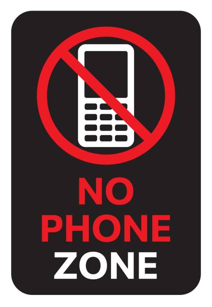 istock No phone zone warning sign. Illustration with text: NO PHONE ZONE. Black symbol prohibiting phone use. Vector icon for mobile restrictions 1761887294
