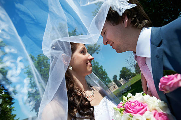 istock Happy bride and groom in park 176192715