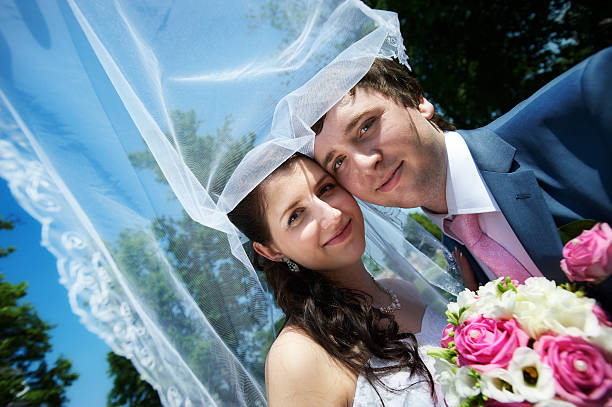 istock Happy bride and groom in park 176192716