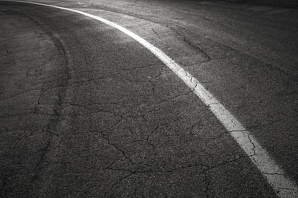 istock Turning asphalt road with white dividing line 176195486
