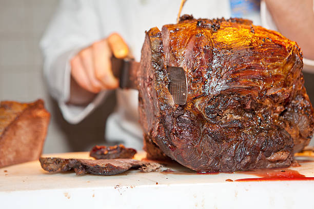 Roast meat is being carved