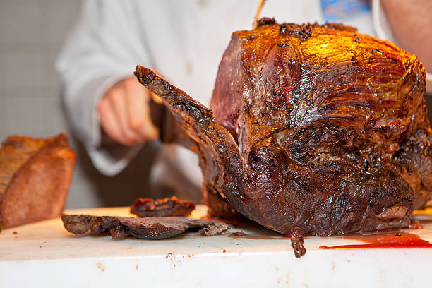 Roast meat is being carved