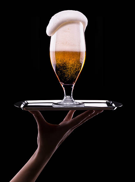 istock Frosty glass of light beer on black background 176197569