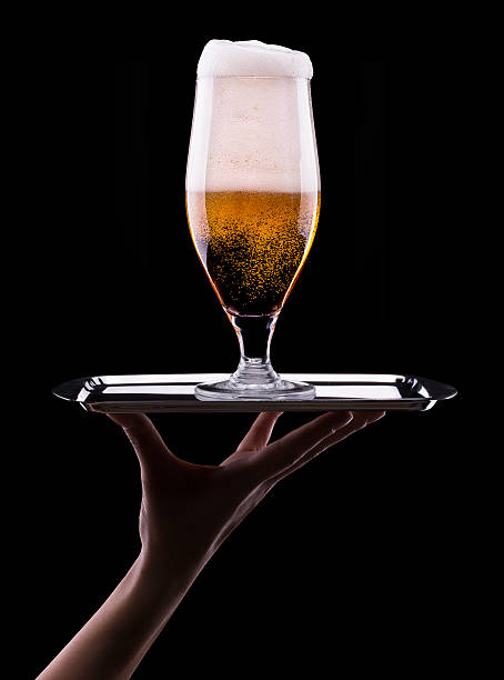 istock Frosty glass of light beer on black background 176198071