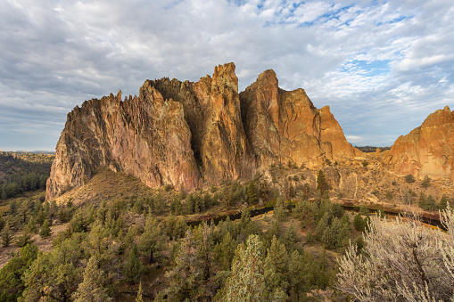 Beautiful rock against cloudy sky in Smith Rock State Park in Oregon, USA