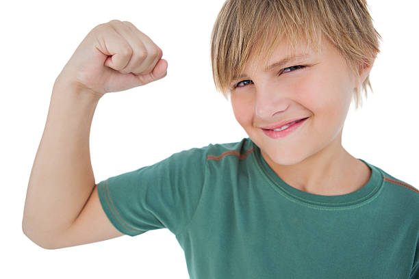 istock Little boy tensing arm muscle 176204112
