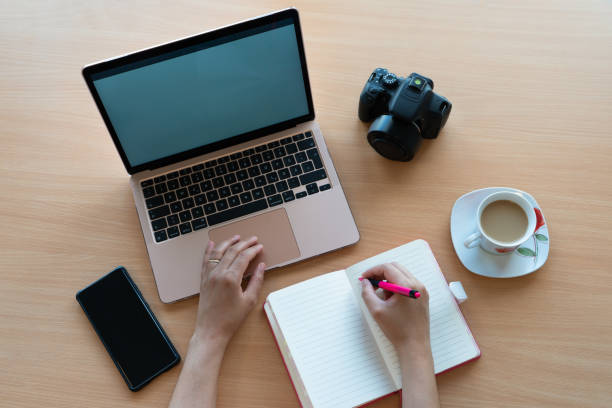 istock Hands of photographer working on laptop 1762065616