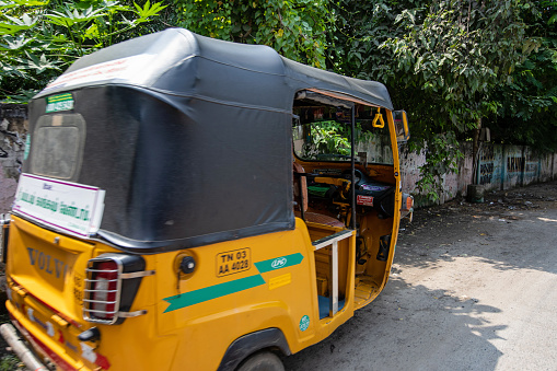 Chennai, India - October 17, 2023. An autorickshaw is parked on the side of the road in Chennai.