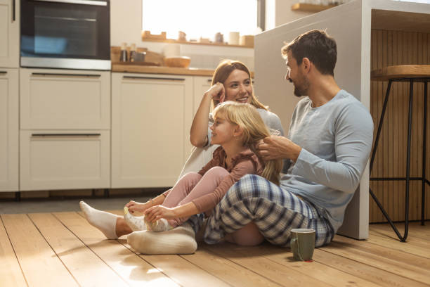 istock Young cheerful family having fun at kitchen 1762096747
