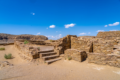 Stunning ancient Indian ruins, dwelling in a desert environment. Massive structures and unique rock construction.